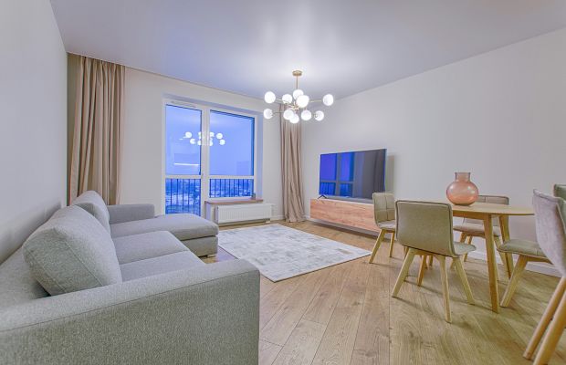 Grey Fabric Sectional Sofa on Brown Wooden Floor